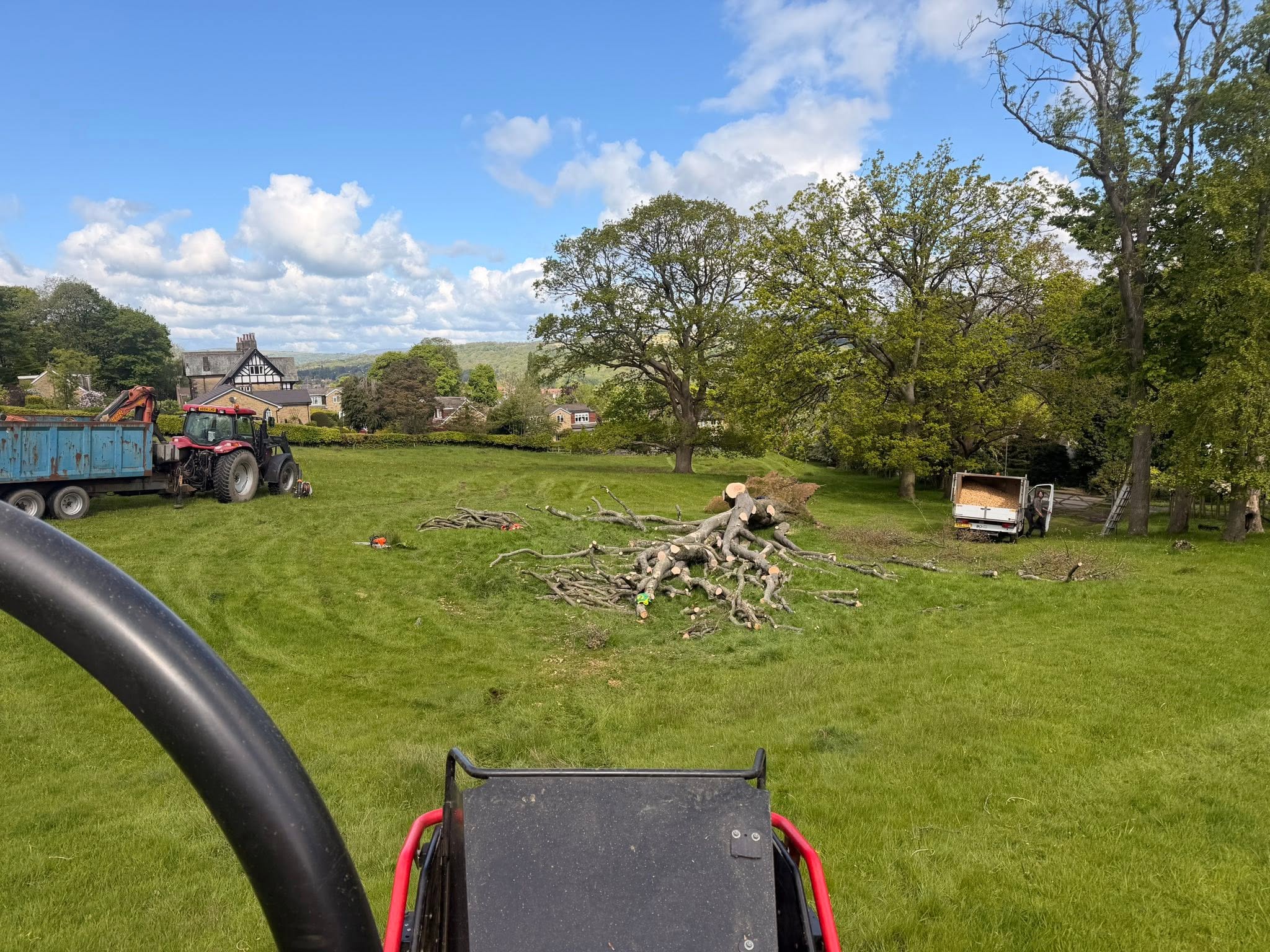 Chevin’s tree surgery team and vehicles working at a grassy site